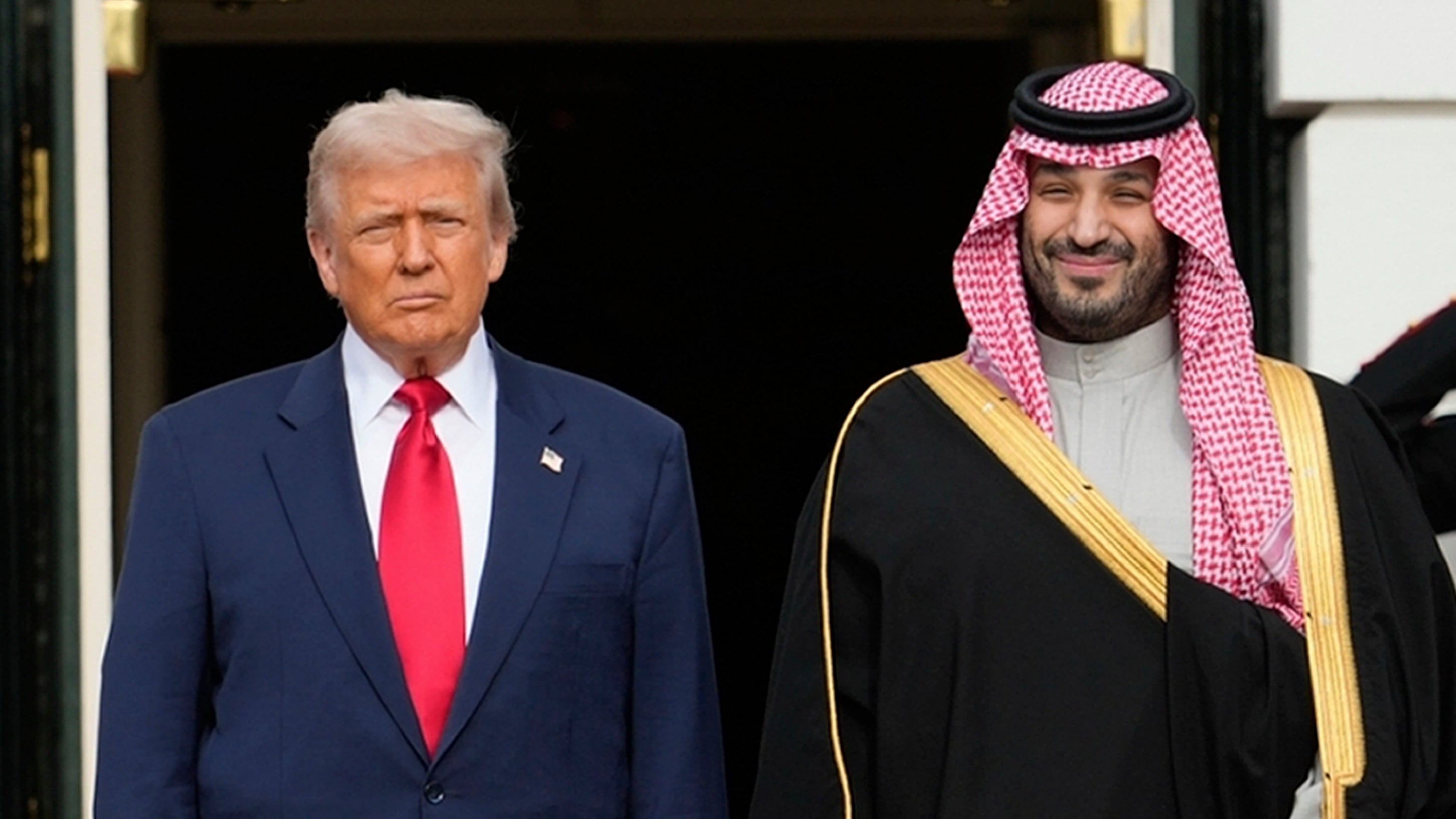 U.S. President Donald Trump stands with Saudi Arabia's Crown Prince Mohammed bin Salman on his visit to the White House in Washington on Nov. 18, 2025. (Mark Schiefelbein / AP Photo)