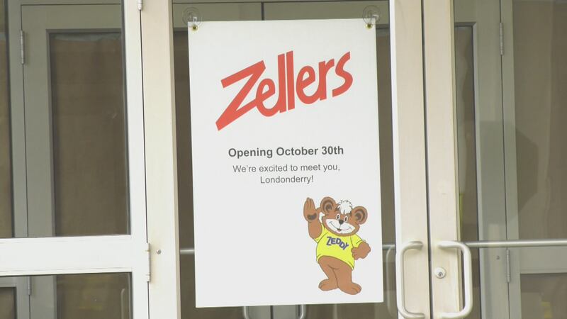 Signs showing the new opening date for Zellers posted outside the old Hudson's Bay retail space in Londonderry Mall Oct. 2025.