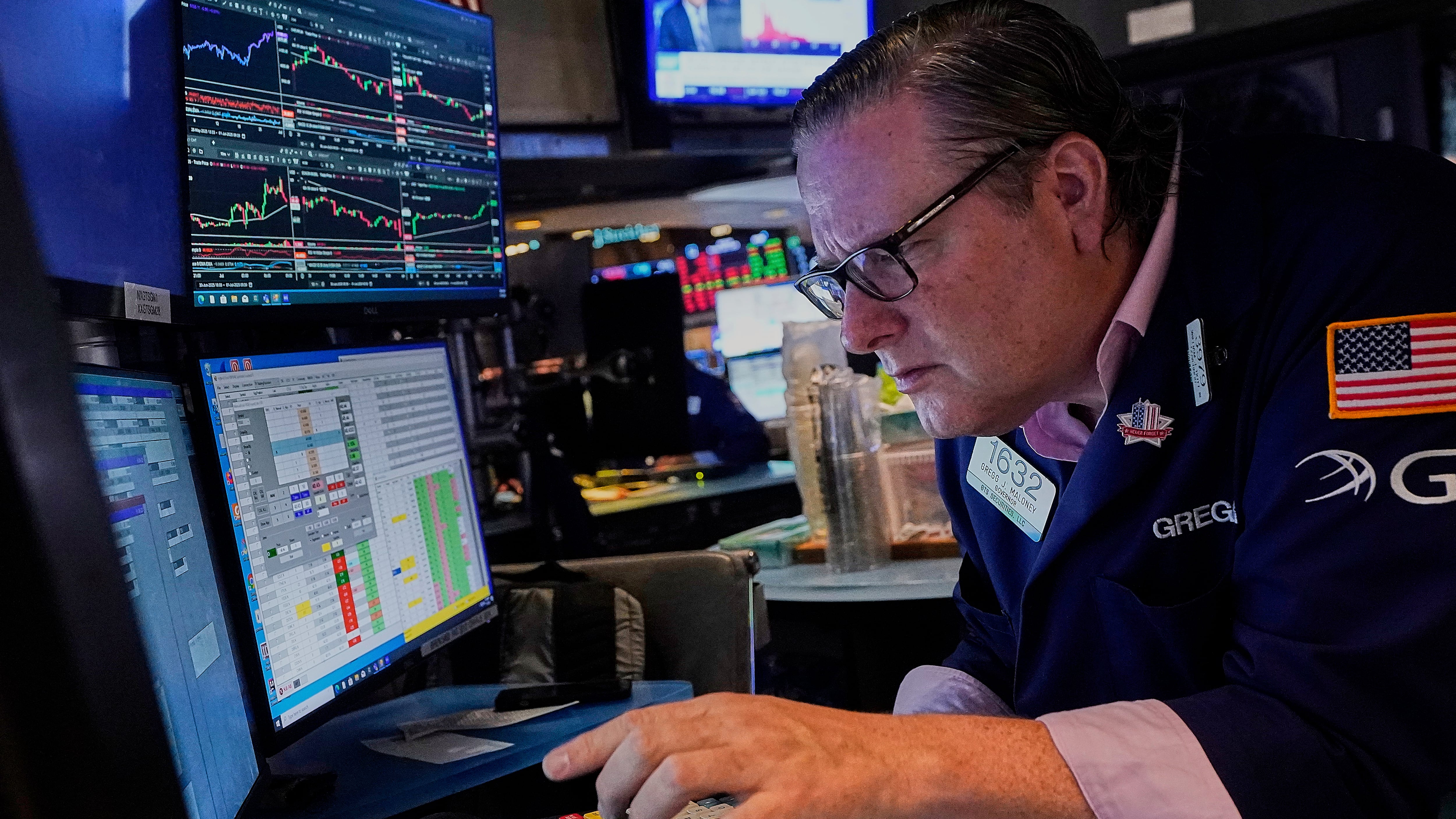 Specialist Gregg Maloney works at his post on the floor of the New York Stock Exchange, Tuesday, July 1, 2025. (AP Photo/Richard Drew)