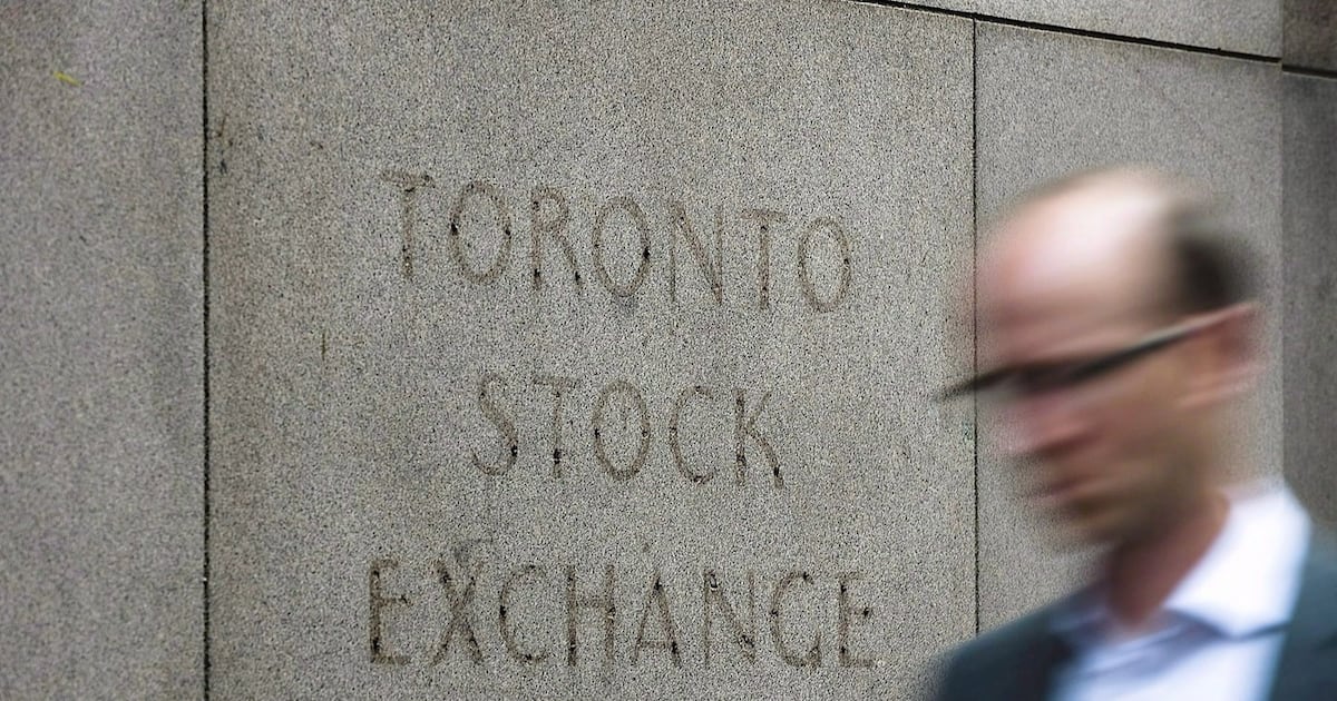 Photo: BNN Bloomberg A man walks past a building in Toronto that used to house the Toronto Stock Exchange on Aug. 18, 2011.THE CANADIAN