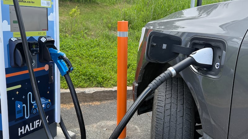 An electric truck is plugged in. (Callum Smith/CTV News)