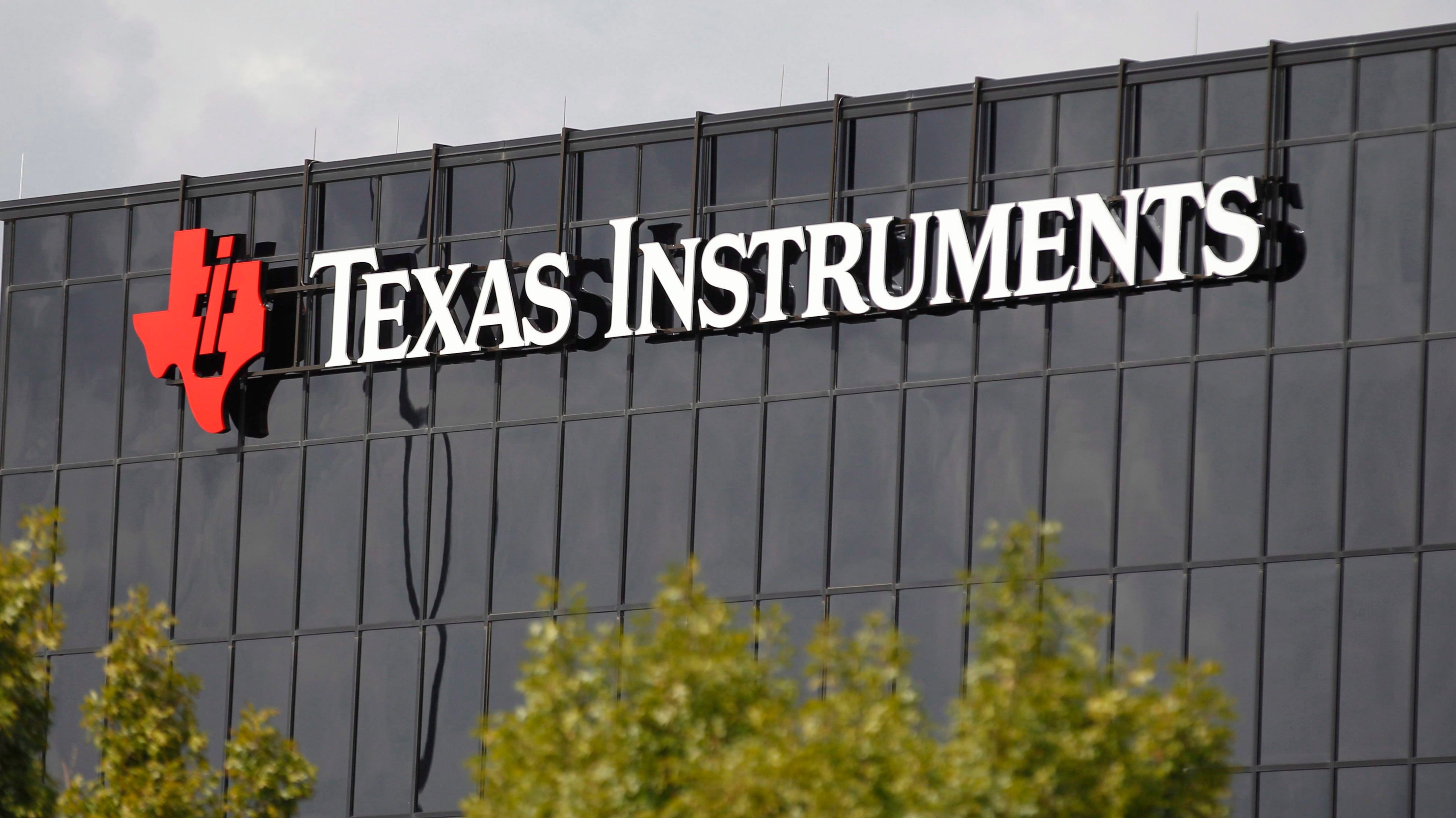 Corporate signage on the offices of Texas Instruments, in Richardson, Texas. On Tuesday, July 17, 2018. (AP Photo/LM Otero, File)