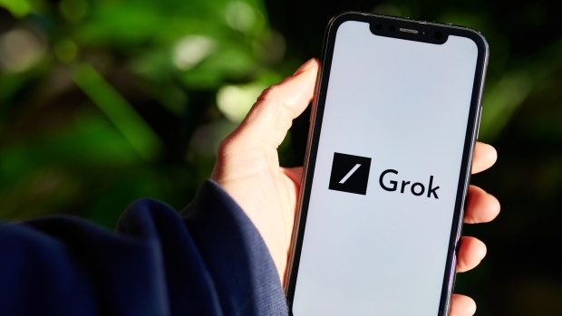 The Grok logo on a smartphone arranged in New York, US, on Wednesday, Nov. 8, 2023. Elon Musk revealed his own artificial intelligence bot, dubbed Grok, claiming the prototype is already superior to ChatGPT 3.5 across several benchmarks. Photographer: Gabby Jones/Bloomberg