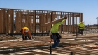 <p>Contractors frame walls on a house in Folsom, California.</p>