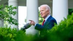 U.S. President Joe Biden stands at a lectern